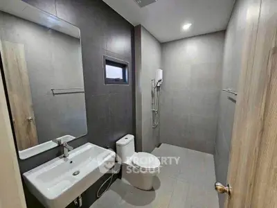 Modern minimalist bathroom with sleek fixtures and neutral tones