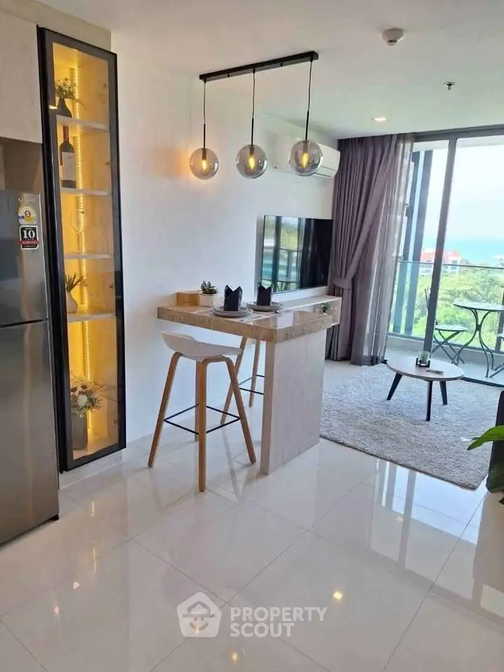 Modern open-plan living room with stylish decor and balcony view