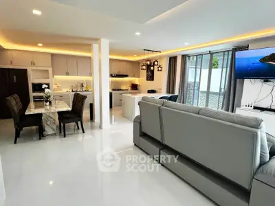 Spacious modern living room with open kitchen and elegant dining area