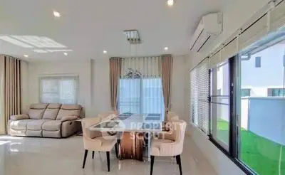 Spacious modern living room with elegant dining area and large windows for natural light.