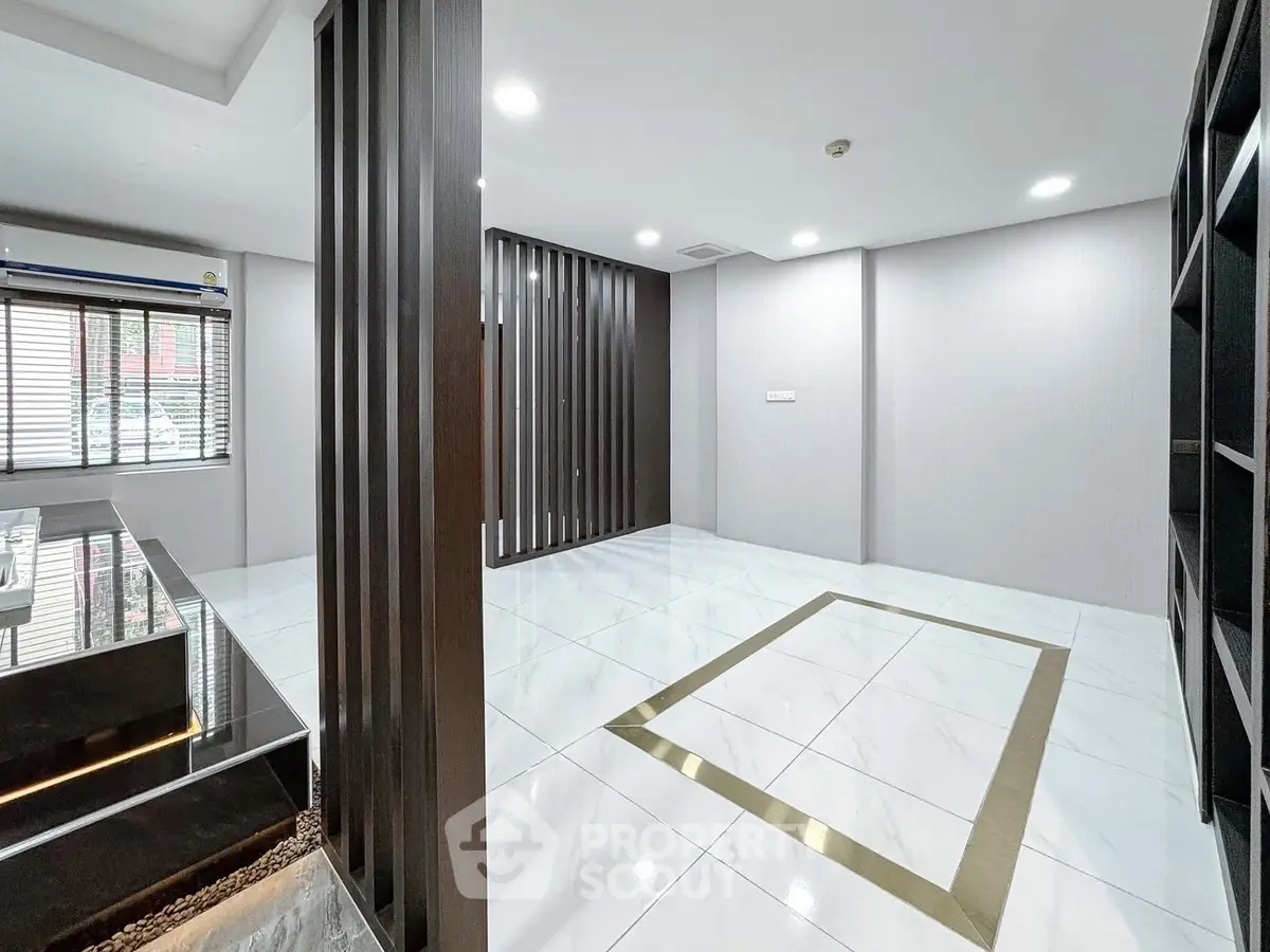 Spacious modern living room with sleek design and elegant flooring