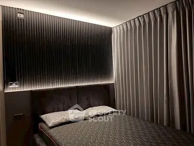 Luxurious modern bedroom with elegant lighting and stylish decor