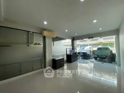 Spacious modern office space with large windows and ample natural light.
