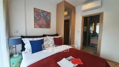 Cozy bedroom with vibrant decor and modern amenities