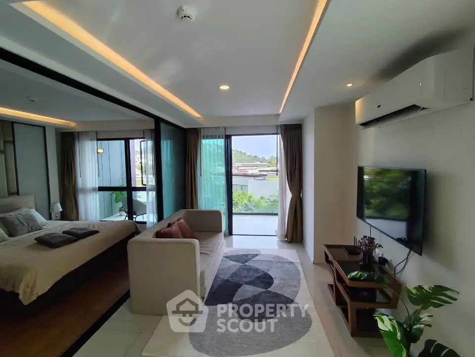 Modern living room with stylish decor and large windows offering scenic views