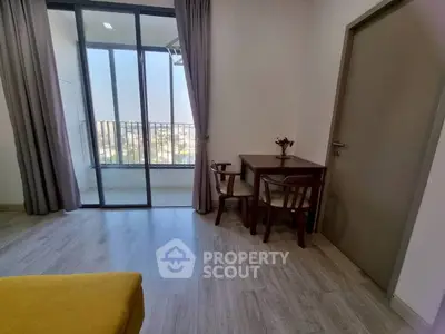 Charming apartment with balcony view and cozy dining area, perfect for urban living.
