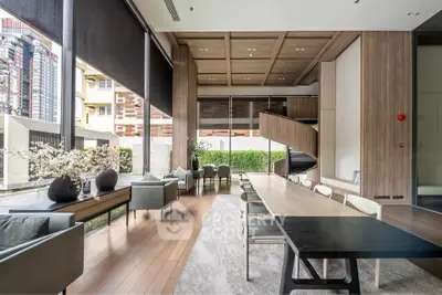 Luxurious modern living room with high ceilings and elegant decor in a stylish apartment.