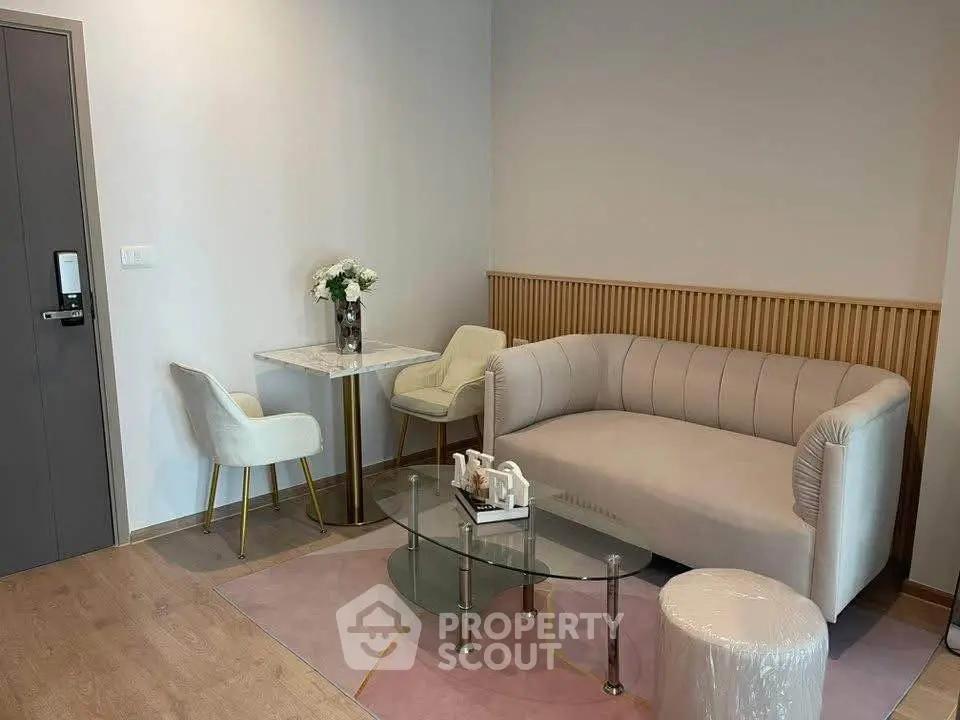 Modern living room with elegant sofa and chic decor in a stylish apartment.