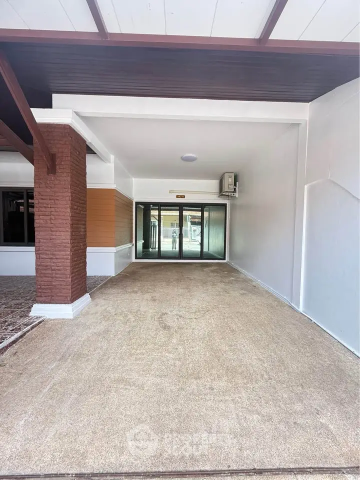 Spacious building entrance with modern design and ample natural light.