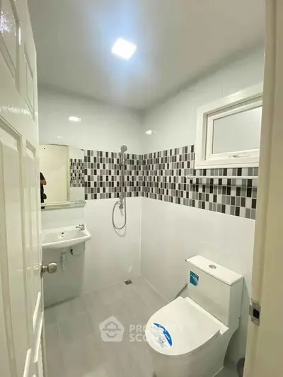 Modern bathroom with sleek design and stylish tile accents