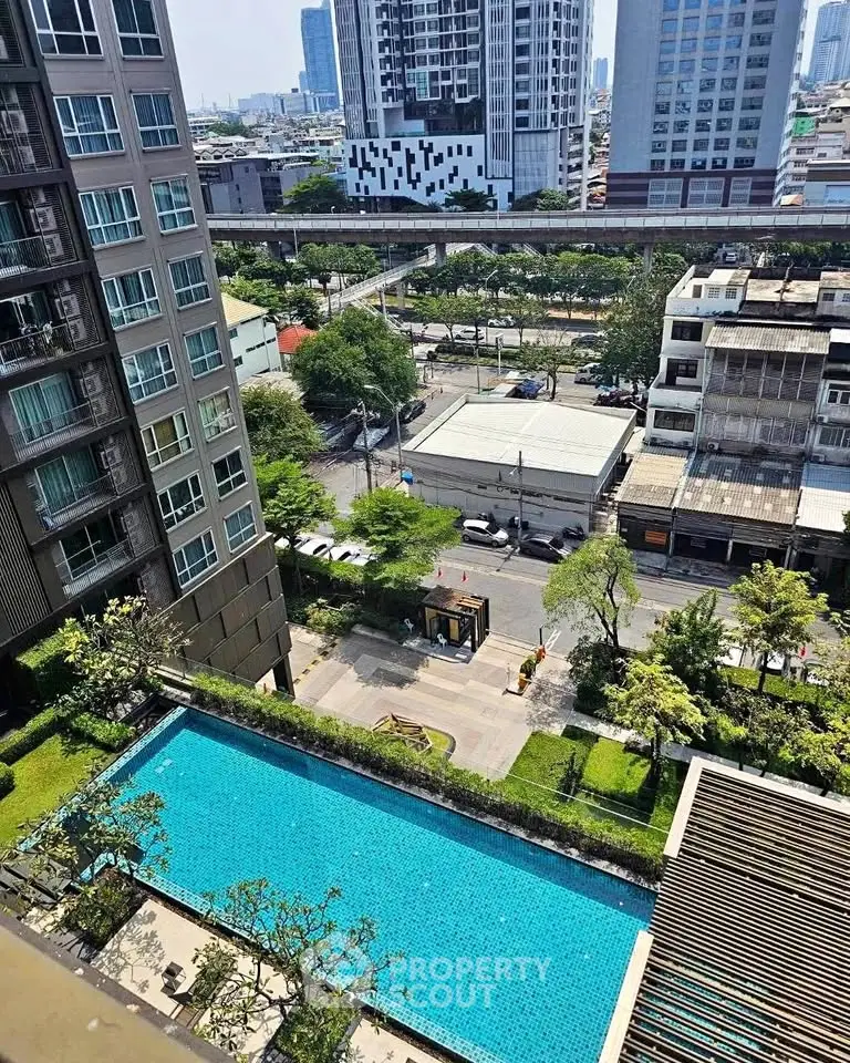 Stunning urban view with a luxurious pool in a modern residential complex.