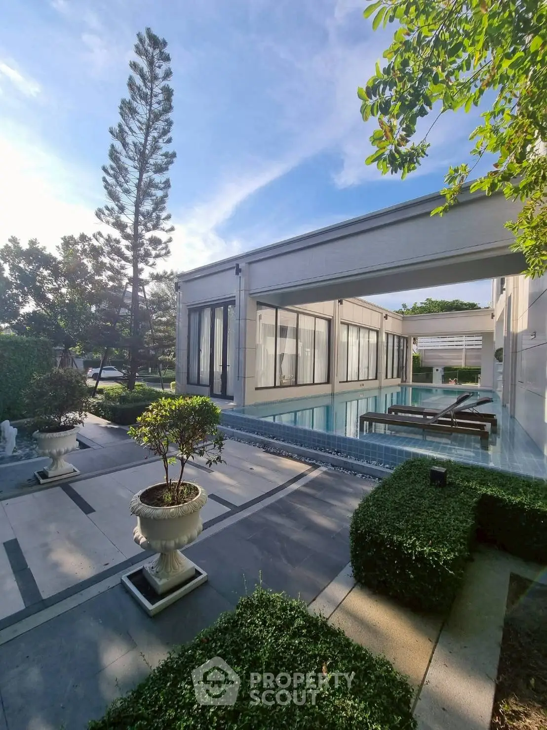 Luxurious modern villa with private pool and lush garden, perfect for serene living.