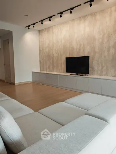 Modern living room with sleek design and cozy seating area