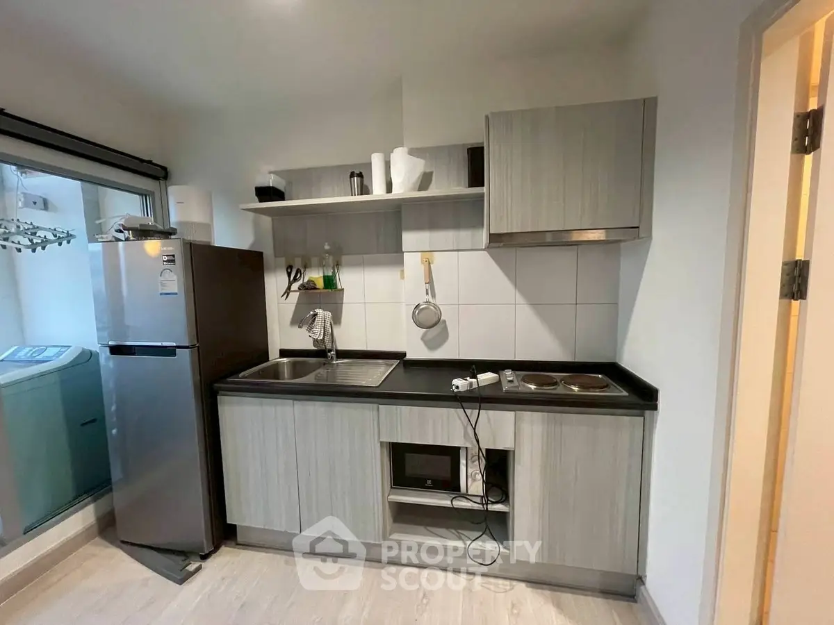 Modern kitchen with sleek cabinetry and stainless steel appliances