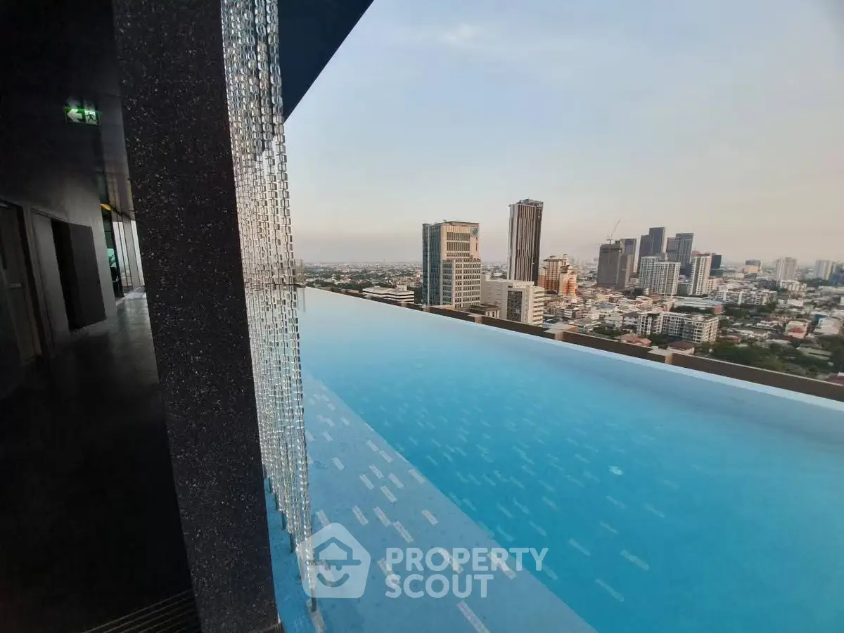 Stunning rooftop infinity pool with breathtaking city skyline view