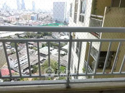 High-rise balcony with safety netting offering panoramic city views.