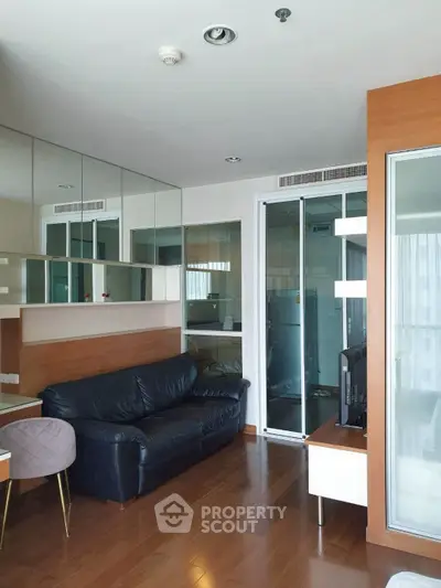 Modern living room with sleek design and wooden flooring