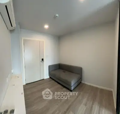 Cozy minimalist living room with sofa and wooden flooring