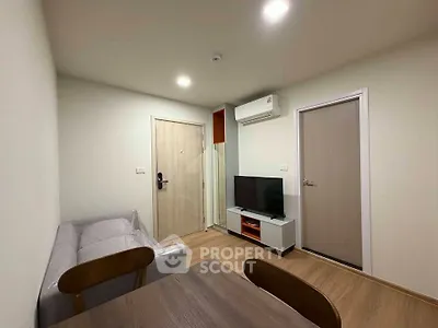 Modern living room with sleek furniture and air conditioning in a cozy apartment.