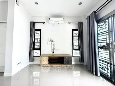 Modern minimalist living room with sleek air conditioning and stylish decor