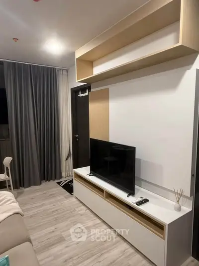 Modern living room with sleek TV stand and stylish shelving