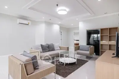 Spacious modern living room with stylish furniture and neutral decor