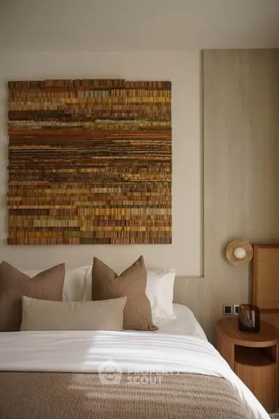 Cozy bedroom with stylish wall art and neutral decor