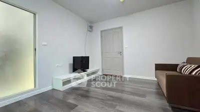 Modern living room with sleek flooring and minimalist decor