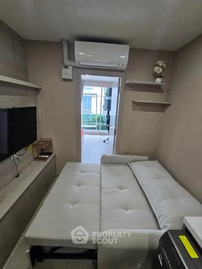 Cozy compact living room with sofa bed and modern decor