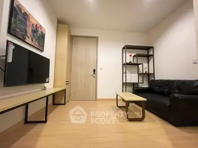 Modern living room with sleek furniture and wall-mounted TV, perfect for cozy relaxation.