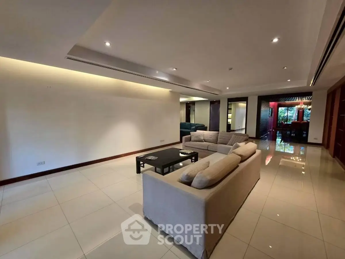 Spacious modern living room with elegant lighting and comfortable seating