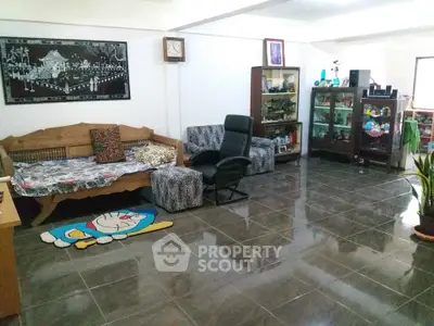 Spacious living room with tiled floor and cozy seating area