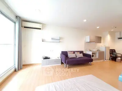 Spacious modern living room with sleek furniture and natural light