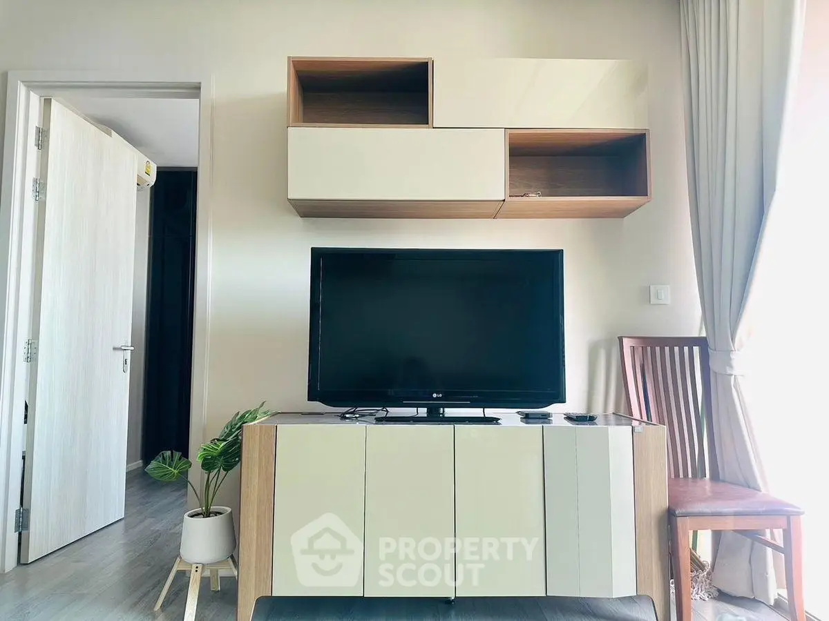 Modern living room with sleek TV unit and stylish decor