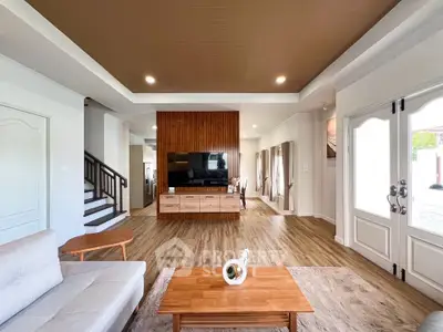 Spacious modern living room with elegant wooden accents and stylish decor