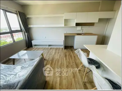 Modern living room with wooden flooring and sleek furniture