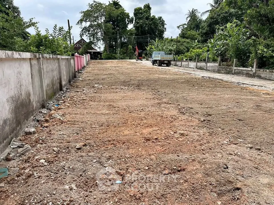Vacant land plot ready for development in a serene suburban area.