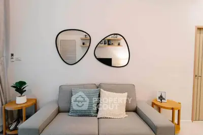 Stylish living room with modern decor and unique mirrors