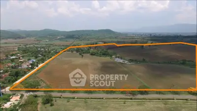 Expansive land plot with scenic mountain views, ideal for development opportunities.