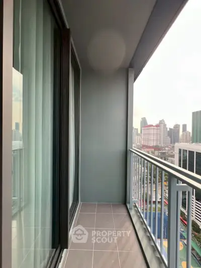 Spacious balcony with city view in modern high-rise apartment