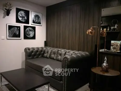 Stylish living room with dark leather sofa and modern decor