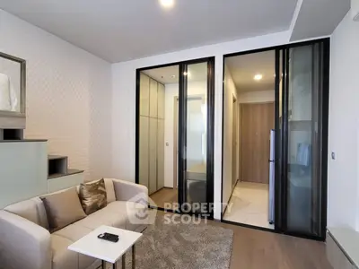 Modern living room with cozy sofa and stylish decor in a contemporary apartment.
