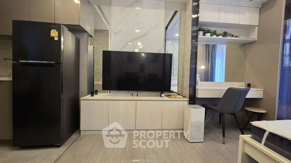 Modern living room with sleek TV setup and stylish furniture