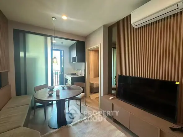 Modern living room with dining area and air conditioning in stylish apartment