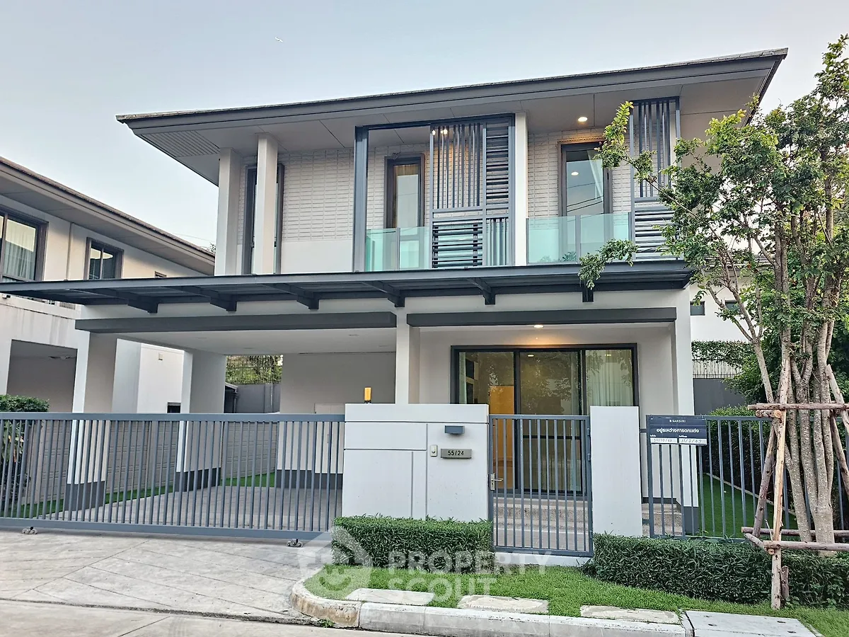 Modern two-story house with sleek design and spacious driveway