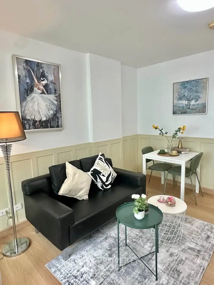 Chic living room with modern decor, cozy seating, and elegant artwork, perfect for stylish urban living.