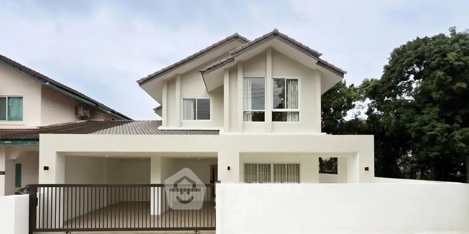 Modern two-story house with sleek design and spacious driveway
