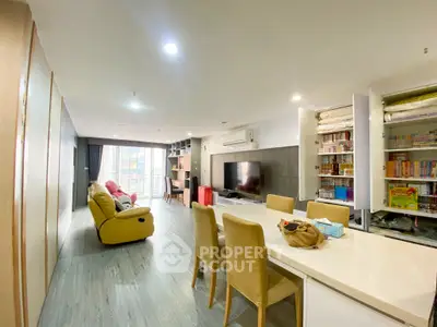 Spacious modern living room with open layout and balcony access