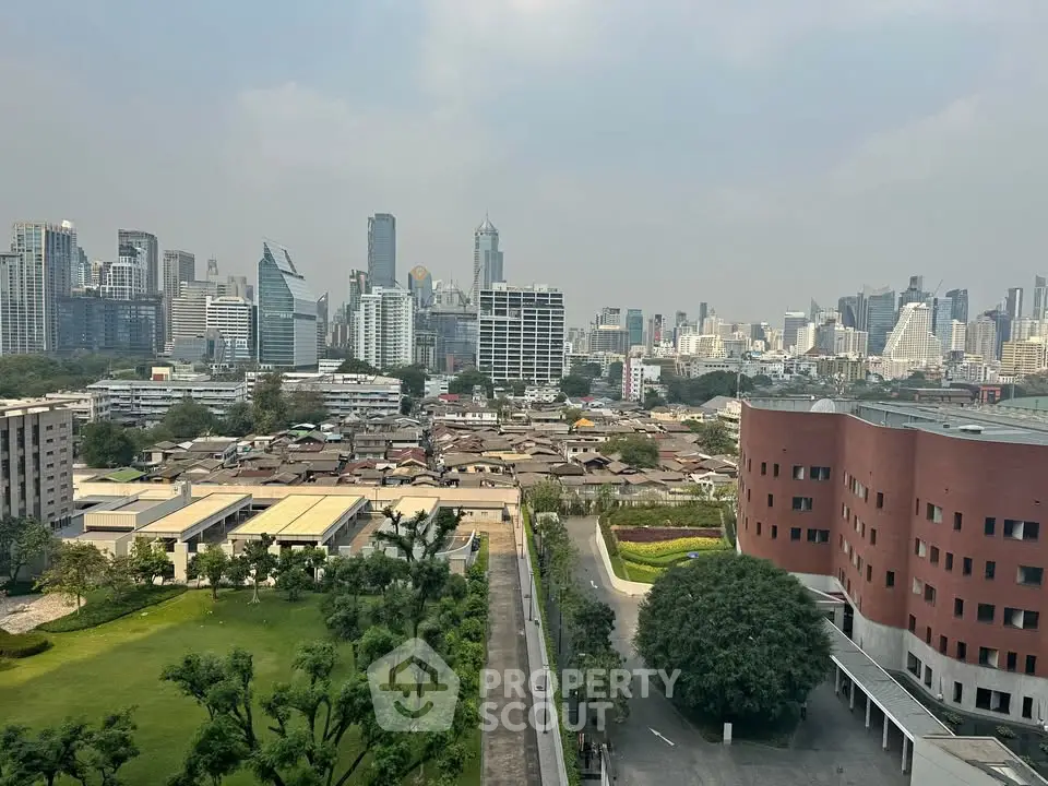 Stunning cityscape view showcasing urban skyline and lush greenery, perfect for real estate investment opportunities.