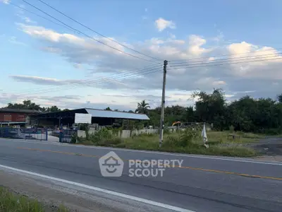 Spacious industrial property with large warehouse and ample outdoor space, ideal for business expansion.